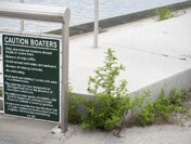 A sign warns boaters on Newtown Creek.